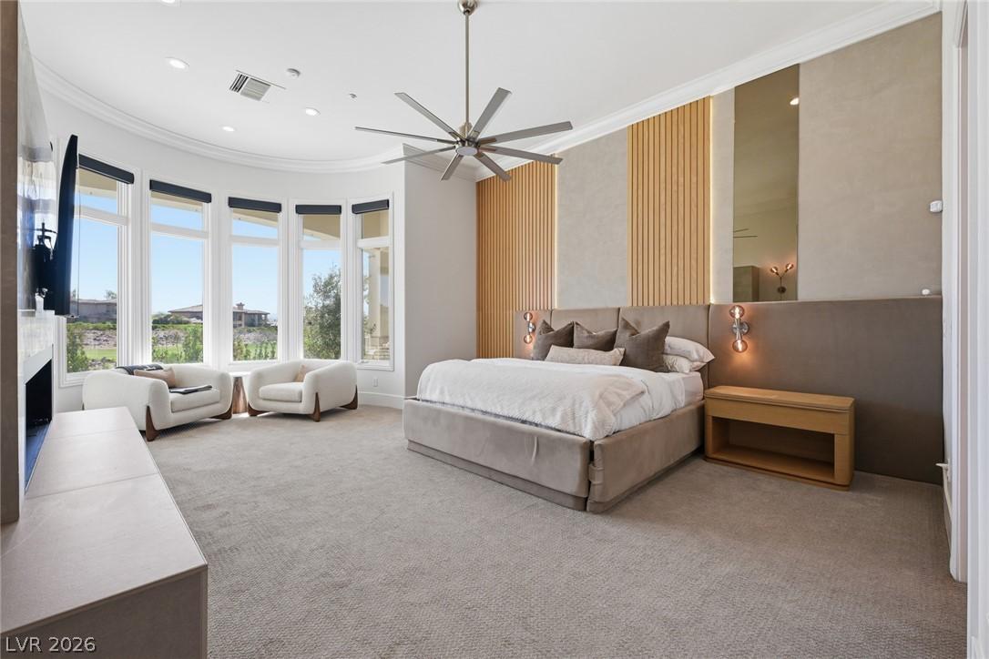 Image 4: Retreat to the primary suite, where a gas fireplac