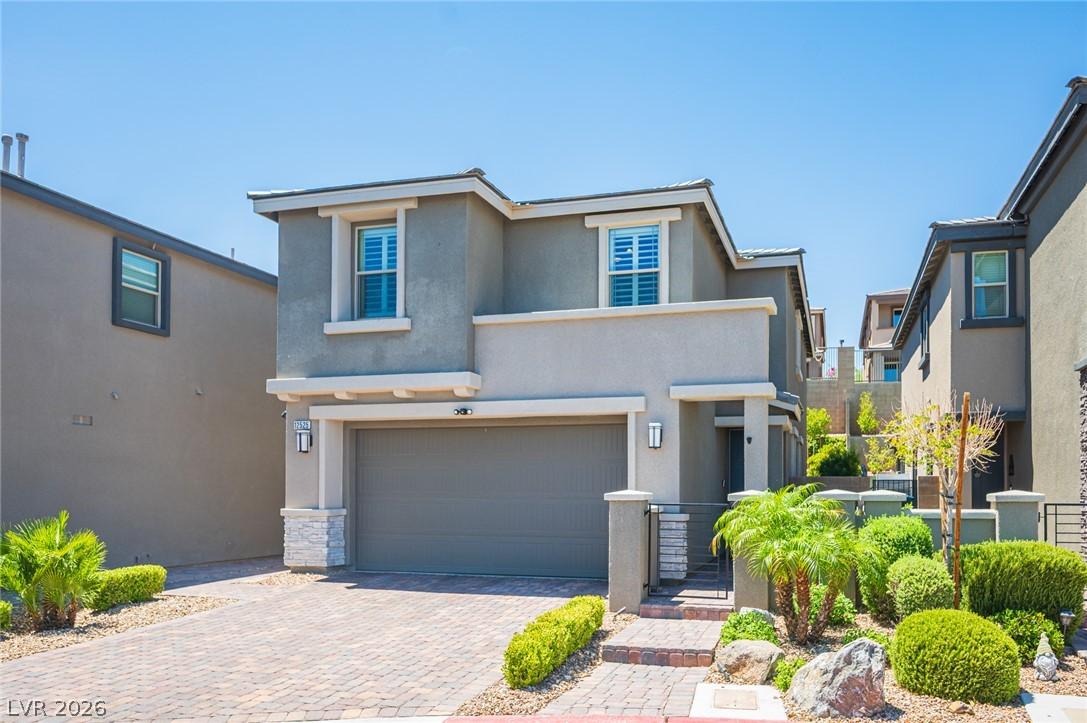 Image 2: A contemporary residence showcasing a paver drivew