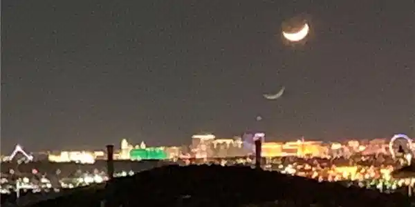 Image 3: Vibrant city lights sparkle across the horizon ben