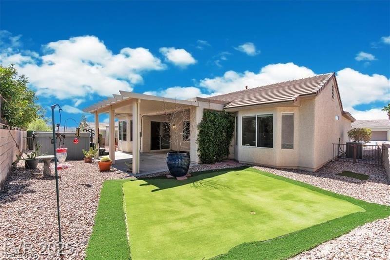 Image 4: Back of property featuring a fenced backyard, a pa