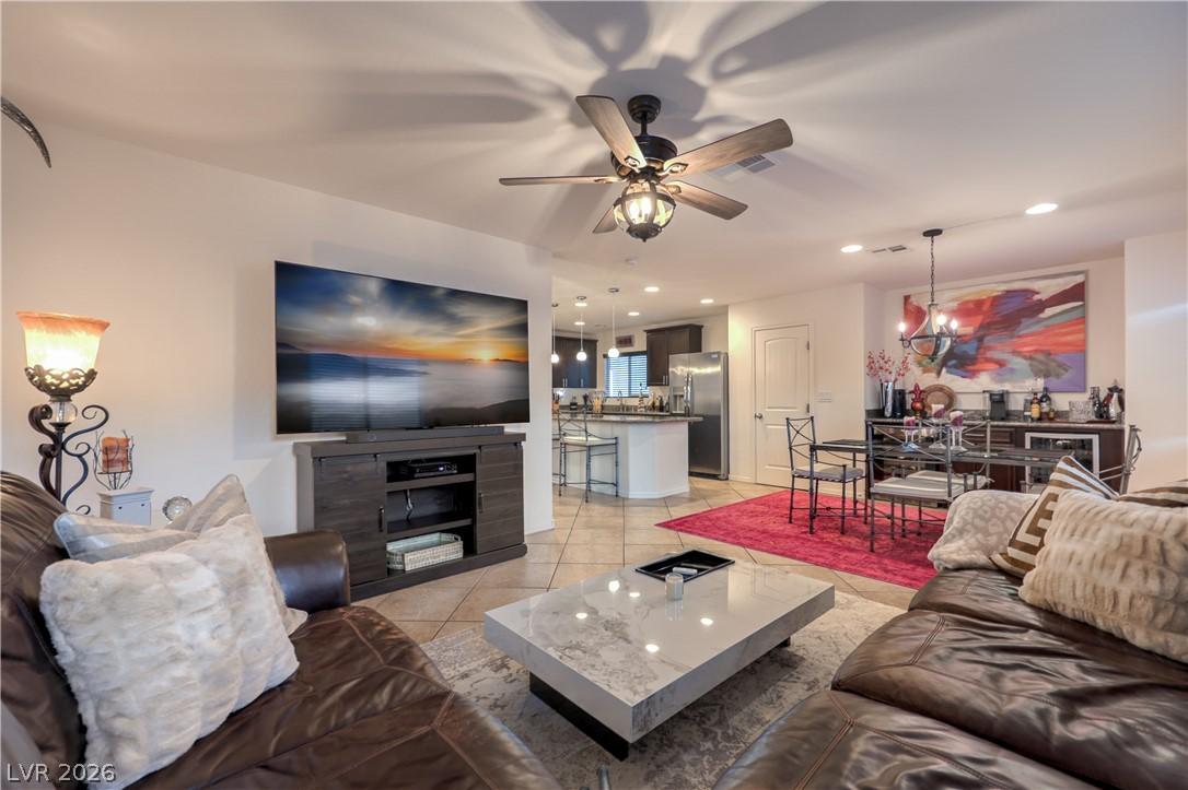 Image 4: An inviting open-concept living space features a s