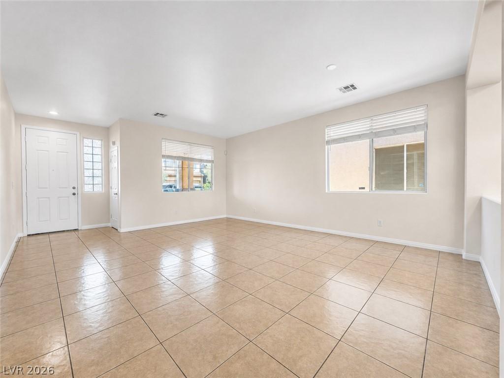 Image 3: A spacious, naturally illuminated living area feat