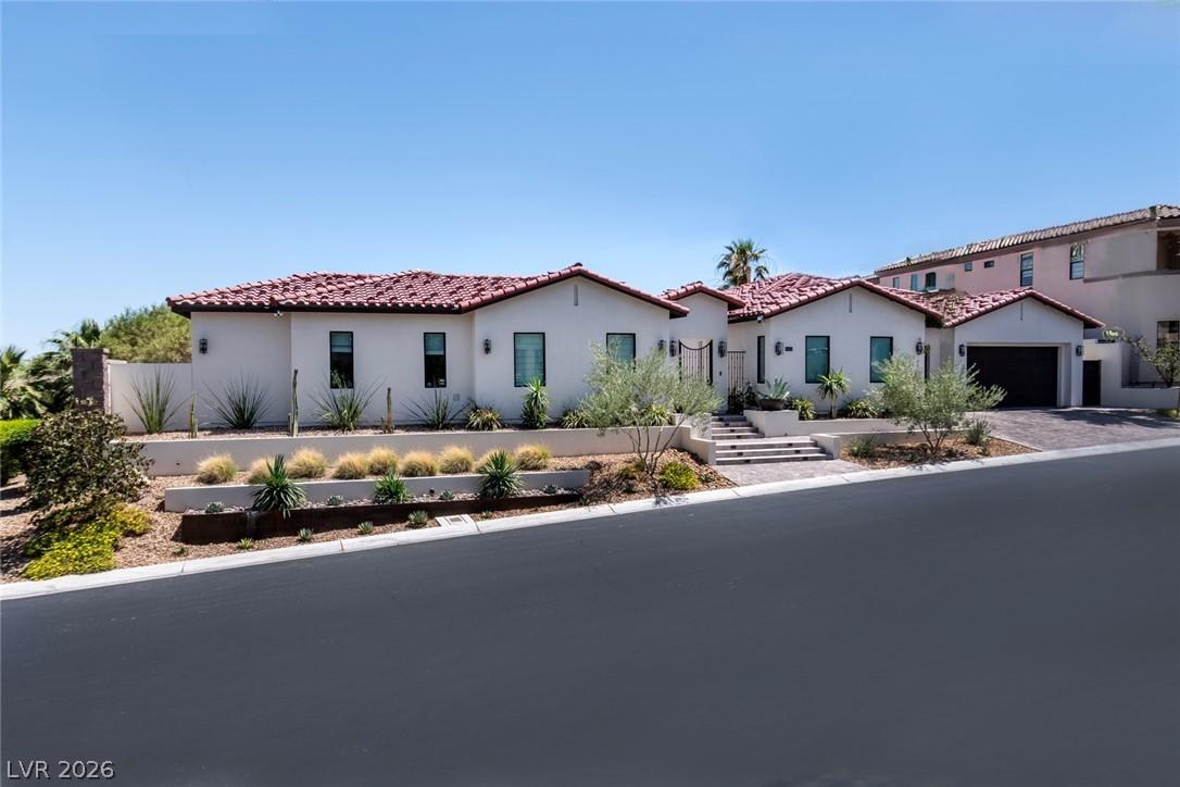 Image 2: Mediterranean-inspired home with a terra cotta roo
