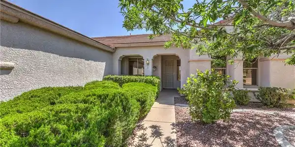 Image 2: A welcoming front path leads to a home boasting ma