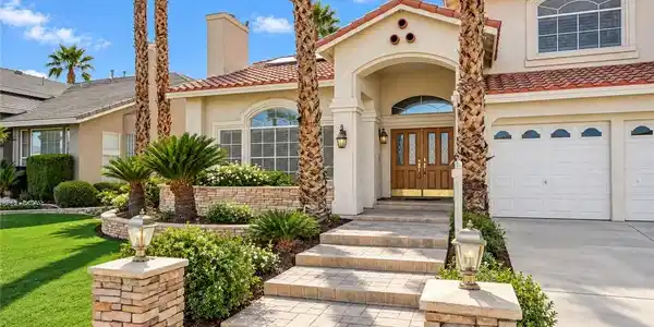 Image 2: Double entry doors and a tiled pathway create a we