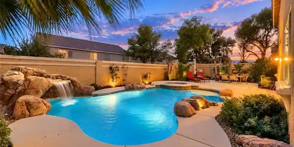 Image 4: Sparkling in-ground pool, spa and cascading waterf
