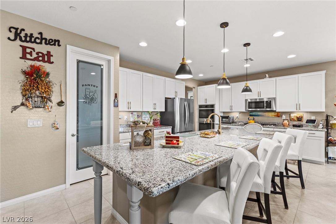 Image 3: This spacious kitchen features ample counter space