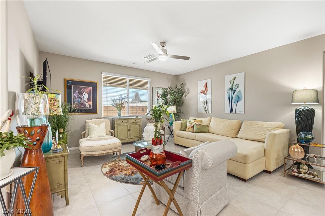 Image 4: This bright living area features comfortable seati