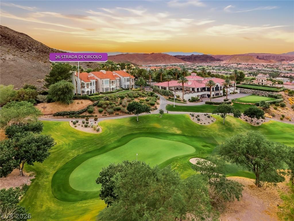 Image 2: Perched above a verdant golf course, this home off