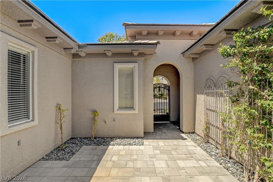 Image 3: A private courtyard entry welcomes you through an