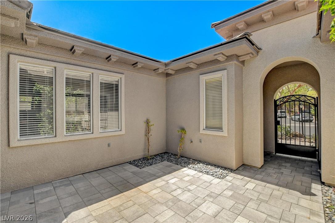Image 4: A private entry courtyard offers a welcoming appro