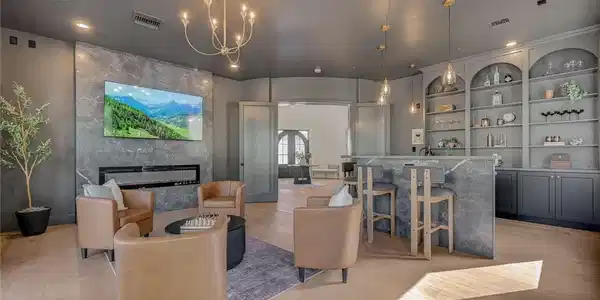 Image 2: Gleaming hardwood floors and a modern stone firepl
