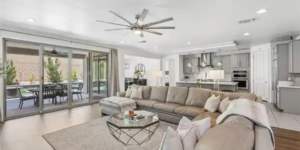 Image 3: Natural light pours into this living space, reveal