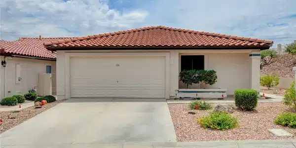 Image 2: Full driveway & 2 car garage . Terracotta-tiled ro