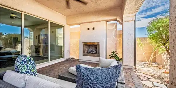 Image 2: An inviting outdoor fireplace highlights this cove