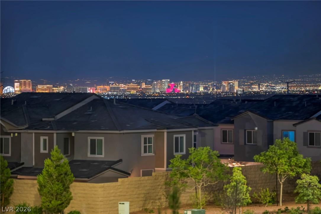 Image 2: City lights twinkle across the night horizon, prov