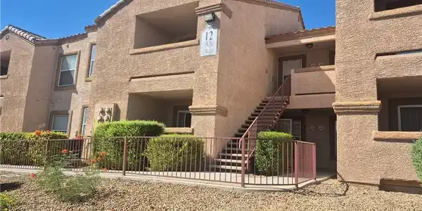 Image 3: A classic stucco exterior welcomes you to this mul