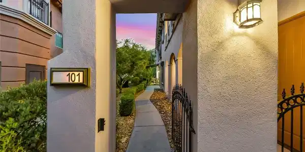 Image 4: An inviting gated entrance leads along a concrete