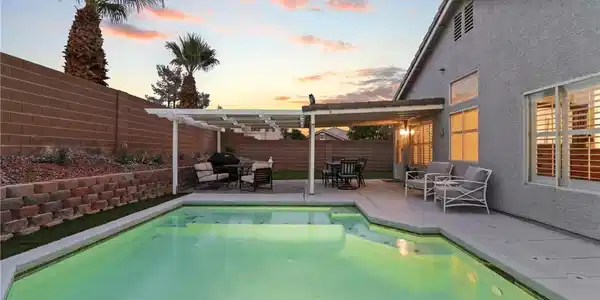 Image 2: A Backyard Oasis with a Sparkling Pool Designed fo