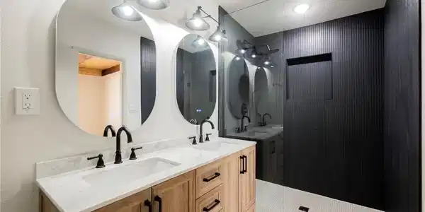 Image 2: Clean modern finishes highlight a double vanity an