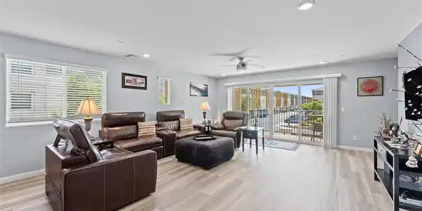Image 2: Sliding glass doors open to a private balcony in t
