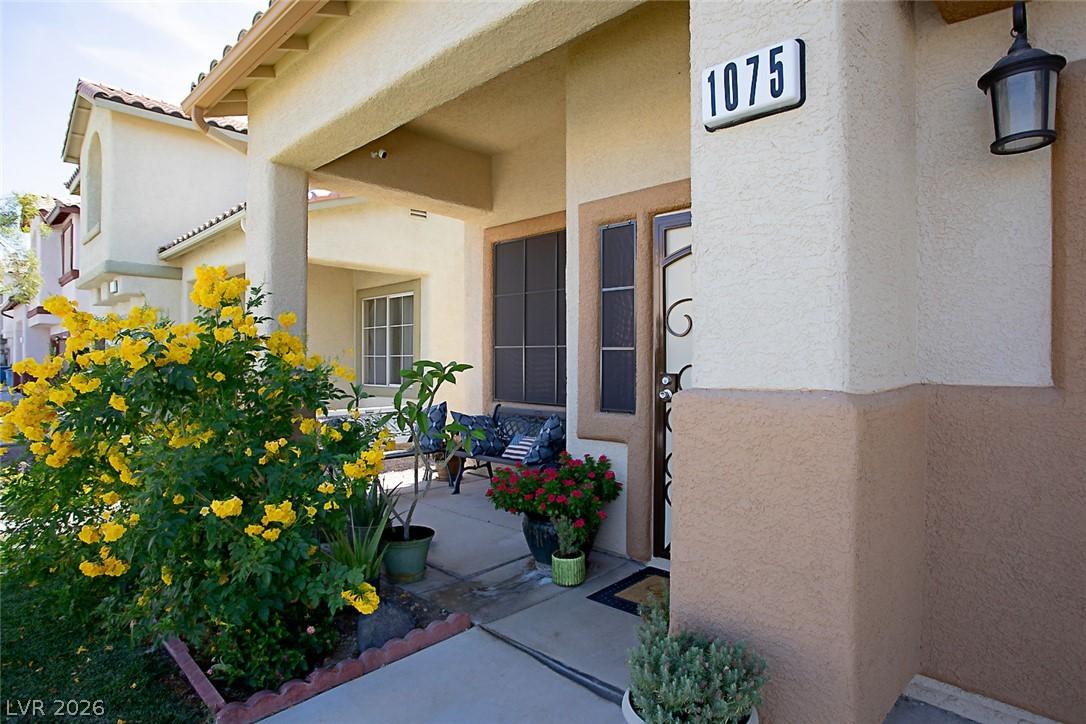 Image 4: A welcoming entry features a covered porch and vib