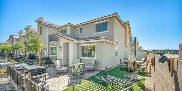 Image 3: An inviting paved patio area offers low-maintenanc