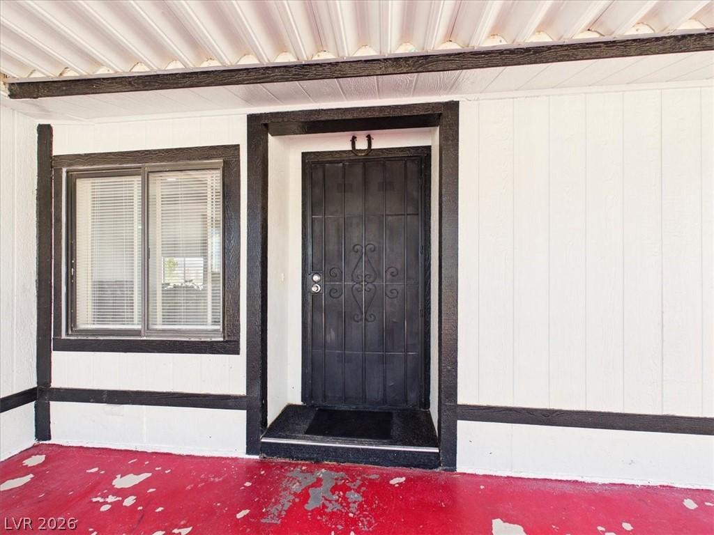 Image 4: The inviting entrance features a security door and