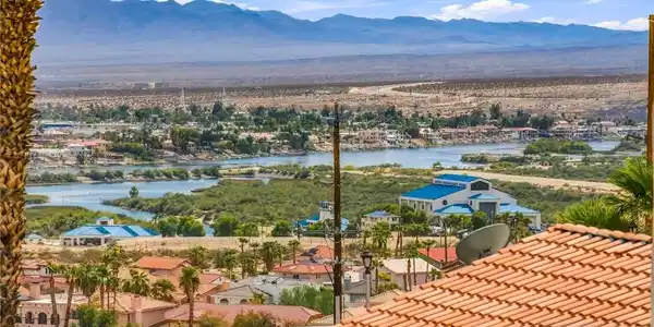 Image 2: Panoramic desert vistas overlook a winding river a
