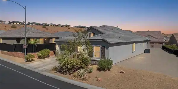 Image 3: Desert landscaping and a durable tile roof enhance