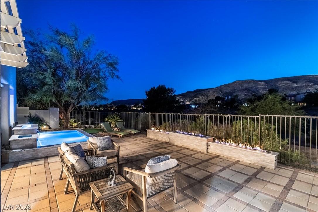 Image 2: Overlooking nightly Lit mountain . Three tier fire