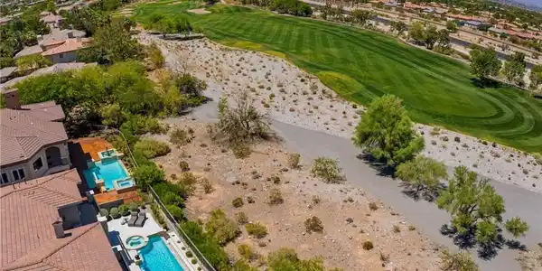 Image 2: An aerial perspective reveals a property, overlook