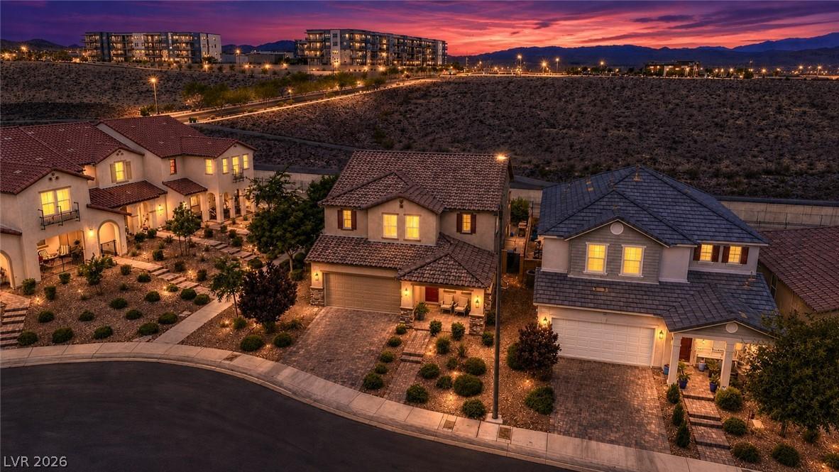 Image 2: Dramatic twilight hues embrace this charming resid