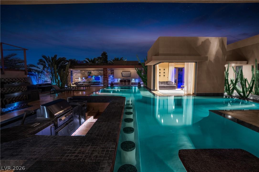 Image 2: This alluring outdoor retreat features a sparkling