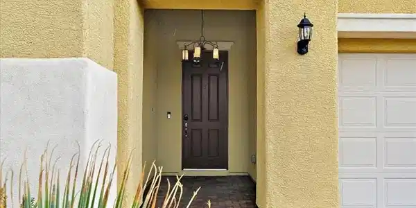 Image 2: An inviting recessed entryway features a textured