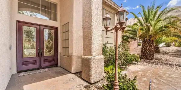 Image 4: Double front doors with ornate glass inserts open