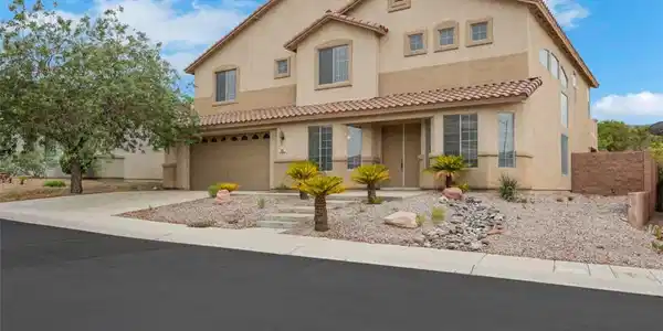Image 2: Clay tile roofing and desert landscaping frame thi