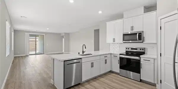 Image 4: Recessed lighting illuminates wood-look flooring a