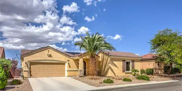 Image 2: Desert landscaping and a tiled roof enhance the cu