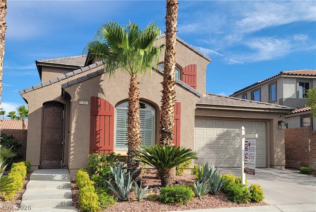 Image 1: A desert-friendly landscape accents the appealing