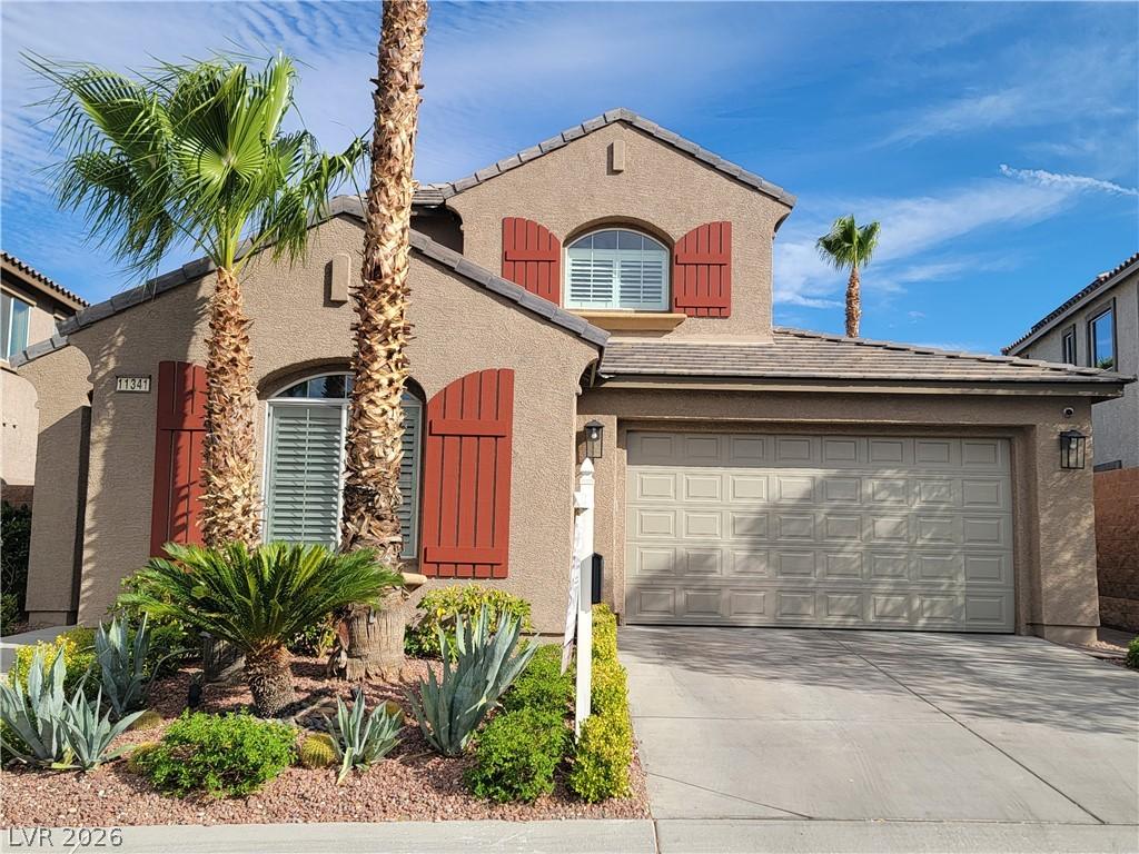 Image 2: A desert-friendly landscape accents the front of t