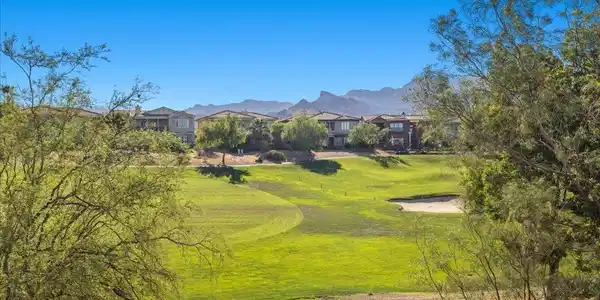 Image 3: Golf course vistas await from this elevated commun