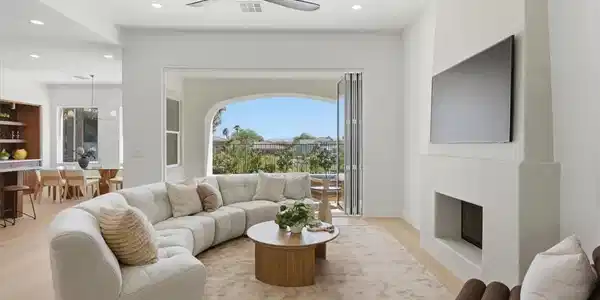 Image 4: An inviting open-concept living area with a firepl