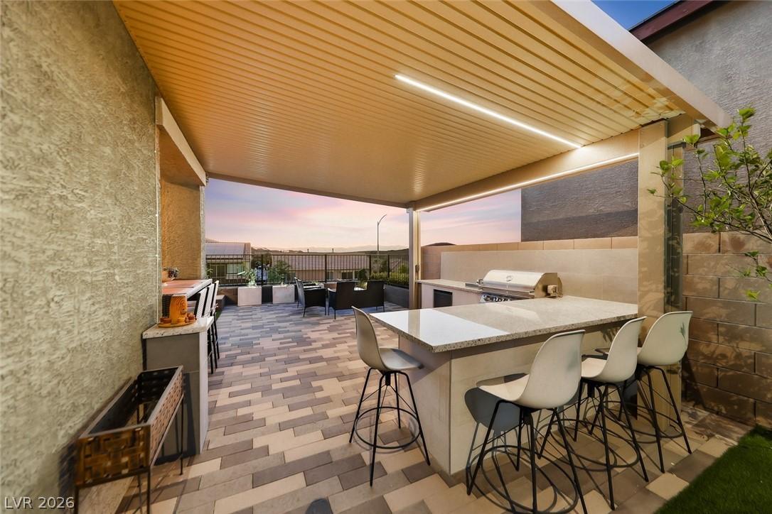Image 4: Covered outdoor patio designed for entertaining, c