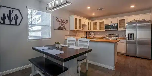 Image 2: Kitchen features stainless steel appliances, light