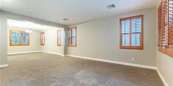 Image 4: Plentiful windows with wooden plantation shutters