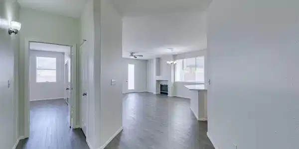 Image 3: This interior captures a spacious living area, ide