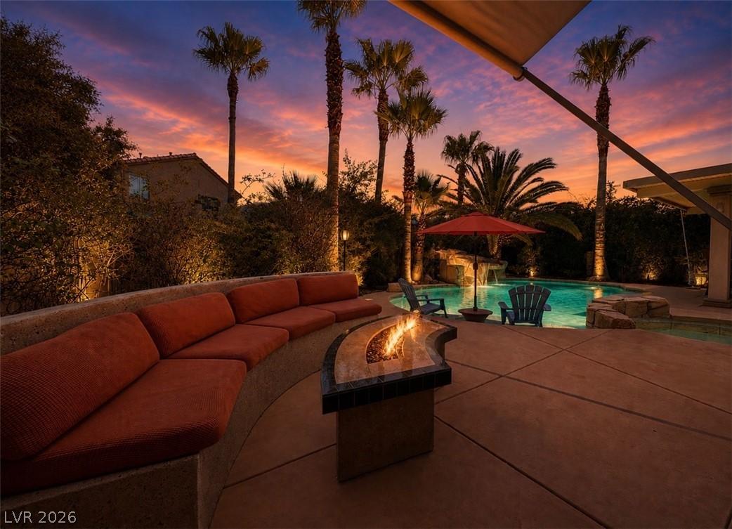 Image 3: An inviting fire pit seating area overlooks a refr