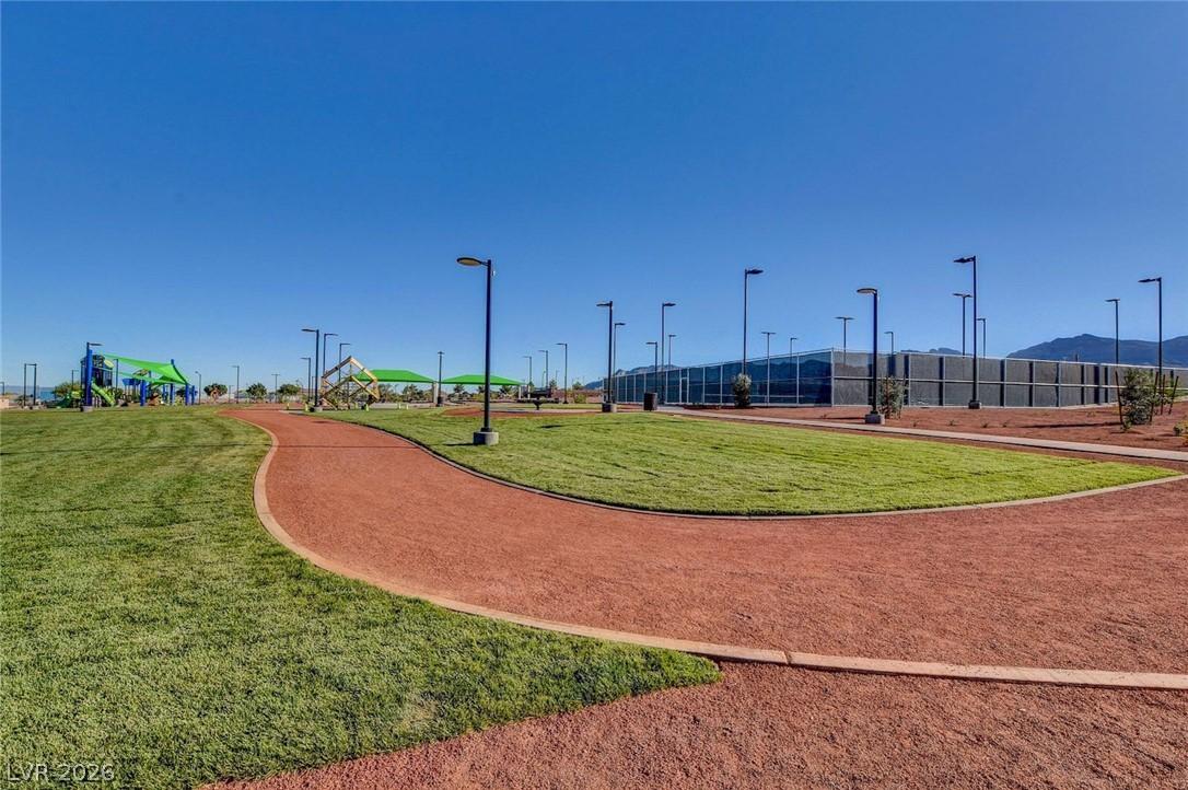 Image 4: A winding path connects vibrant playgrounds and we