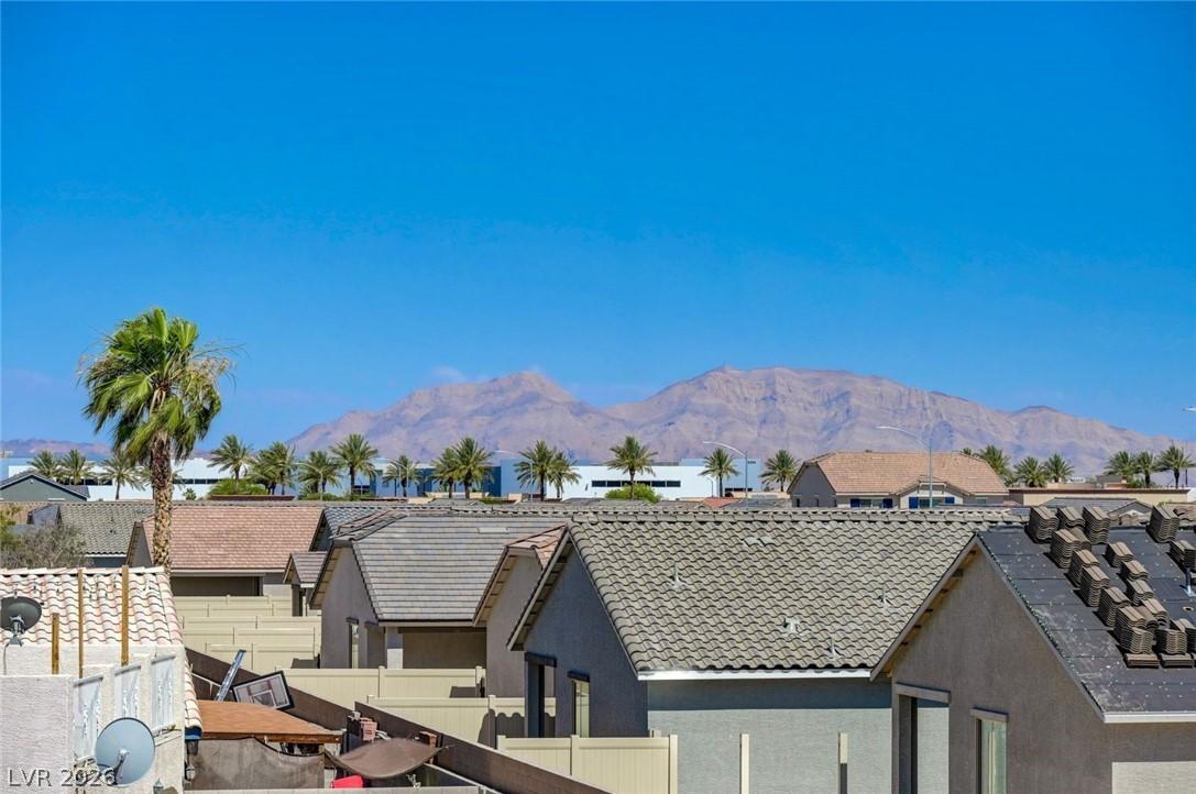 Image 2: A desert panorama showcasing community rooftops ag